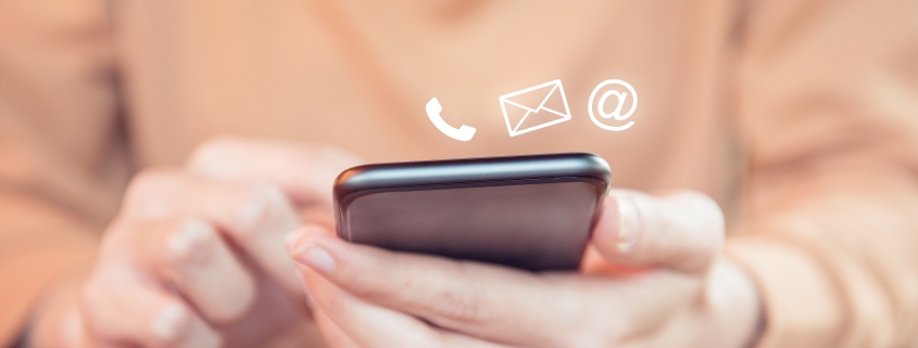 Contact,Us,,Hand,Of,Woman,Holding,Mobile,Smartphone,With,(